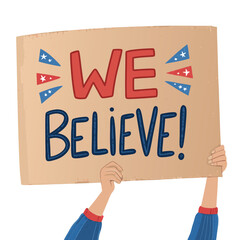 A lone fan at a sporting event holds aloft a handmade cardboard sign, partially visible, displaying only "We (1)".  The image should emphasize the handmade, slightly imperfect nature of the sign.