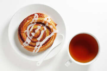Cinnamon roll and tea