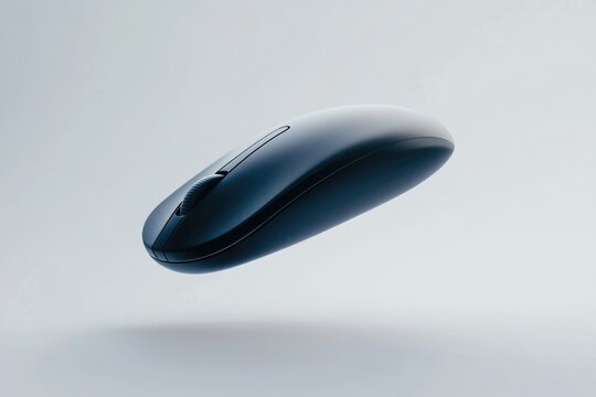 A sleek, dark-grey wireless computer mouse hovers against a light-grey background.