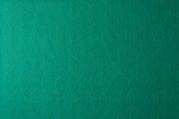 A serene and vibrant solid teal wall, ideal for creating a tranquil atmosphere or as a backdrop.