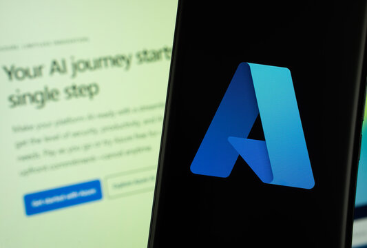 Dhaka, Bangladesh - 17 March 2025: The logo of the microsoft azure is displayed on a smartphone screen, and the website microsoft azure is visible on a computer screen in the background.
