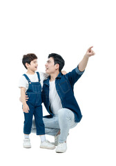 Full body image of Asian father and son posing on white background