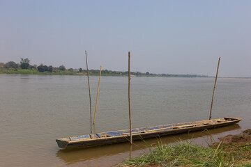 Fishing boat anchored on serene river rural area photography calm environment side view tranquility...