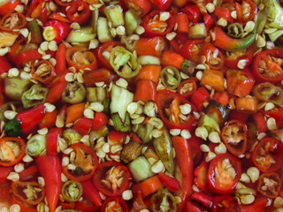 Spicy chili pepper mixing kitchen food preparation colorful environment close-up view culinary delights