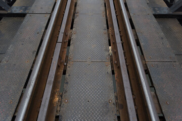 Rusty railway tracks urban setting infrastructure photography industrial environment ground-level...