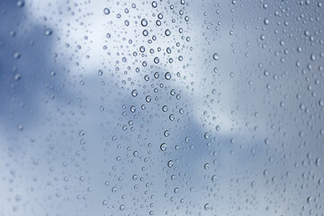 Raindrops on glass urban setting nature photography cloudy atmosphere close-up view weather concept