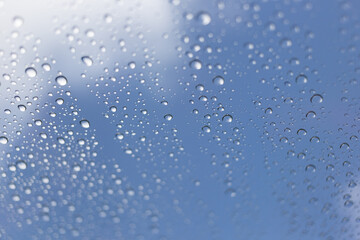 Raindrops on glass urban environment nature close-up sky reflection tranquil viewpoint serenity concept for seo impact