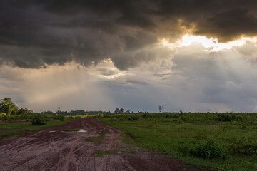 Fototapeta premium Stormy skies over rural landscape nature photography dramatic weather open field wide angle atmospheric beauty