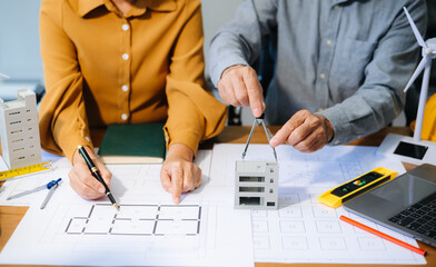 Engineer Teamwork Meeting, Drawing working on blueprint meeting for project working with partner on model building