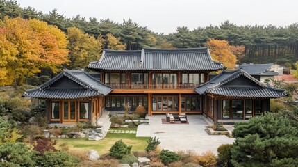 Obraz premium Beautiful traditional Korean house nestled amongst trees in autumn