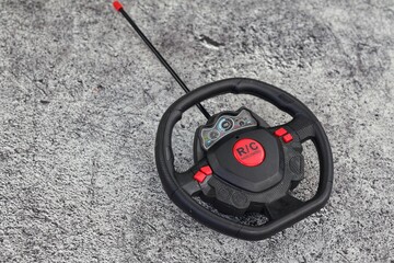 RC Radio Remote Control. Remote control for an RC car isolated on a grey background.