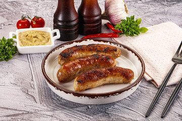 Delicous natural roasted sausages in the plate