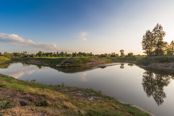 Serenity of sunset reflected in calm river nature scene outdoor peaceful landscape photography