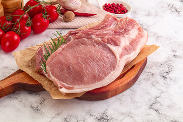Raw potk loin steak with bone
