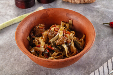 Asian cuisine udon with chicken and vegetables