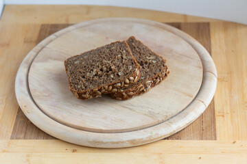 Slices of Whole-Grain Bread on a Wooden Cutting Board