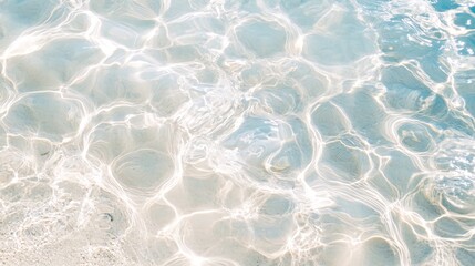 Sunlight through shallow ocean water, beach background