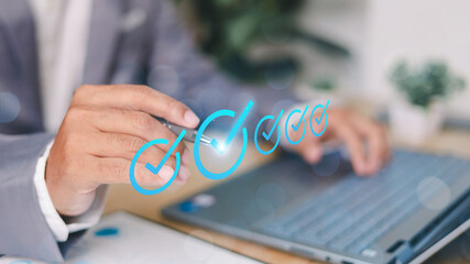 Businessman tick mark an assessment, online survey online exam choose the right answer in the exam,...