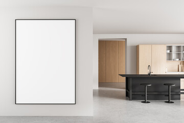 Blank vertical poster mockup on modern wall in minimalist kitchen interior with wooden cabinets and black island counter and stools. 3D Rendering