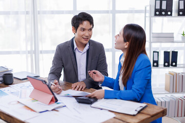 Team of Accounting business are calculating income-expenditure and analyzing real estate investment data on tablet computer, Financial and tax systems concept.
