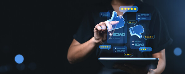 Woman interacting with virtual thumbs and rating icons on digital feedback screen.