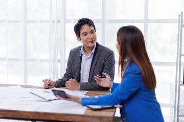 Team of Accounting business are calculating income-expenditure and analyzing real estate investment data on tablet computer, Financial and tax systems concept.
