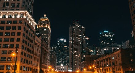 Obraz premium Night Cityscape with Illuminated Buildings