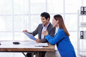 Team of Accounting business are calculating income-expenditure and analyzing real estate investment data on tablet computer, Financial and tax systems concept.
