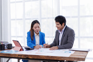 Business finance accounting banking concept. Business hand doing finances and calculate on desk about cost at office. Two Business working on desk with using calculator, finance accounting.