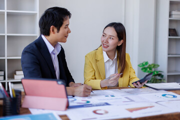 Business finance accounting banking concept. Business hand doing finances and calculate on desk about cost at office. Two Business working on desk with using calculator, finance accounting.