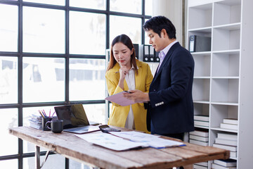  Asian business team creative businesspeople coworker in office Happy to be successful partnership teamwork celebrating achievement and success concept.
