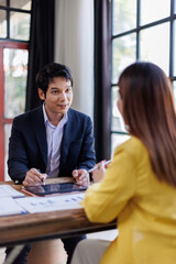Fototapeta premium Team of Business people advisor, business people talking, planning analyze investment and marketing on tablet in office. 