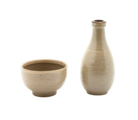 Japanese sand-colored ceramic cup and bowl next to a bottle of Japanese rice wine in the same color, on Png Format and Transparent Background