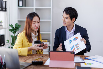 Financial Business team analyze the graph of the company's performance to create profits and growth, Market research reports and income statistics, Financial and Accounting concept.