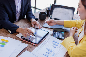 Team Business financing accounting banking concept. Business woman hand doing finances and calculate on desk about cost at home office. Woman working on desk with using calculator, finance accounting.