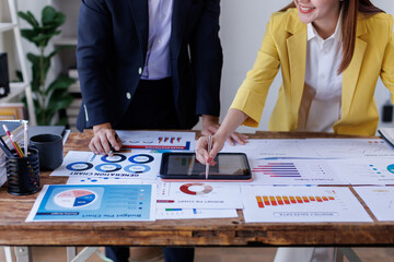 Fototapeta premium Team Business financing accounting banking concept. Business woman hand doing finances and calculate on desk about cost at home office. Woman working on desk with using calculator, finance accounting.