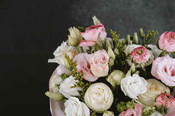 Beautiful mixed bouquet featuring roses and ranunculus arranged elegantly