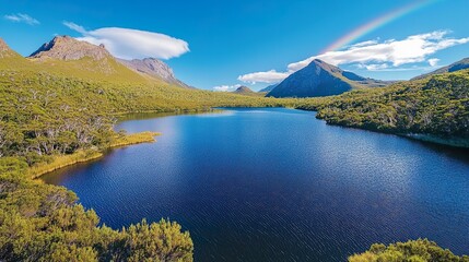 Cradle Mountain landscape featuring still lake reflecting vibrant blue sky