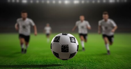 Fototapeta premium Soccer Players Running Towards a Ball on a Grass Field at Night
