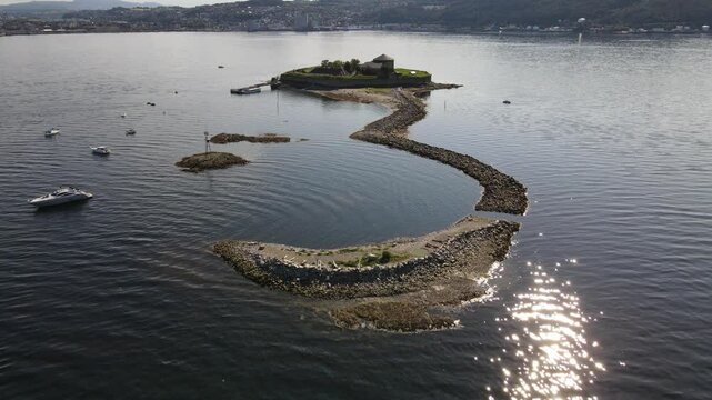 Drone view of Munkholmen (Monk's islet) island surrounded by tranquil waters in Trondheim, Norway