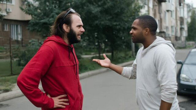 People two men arguing on a street