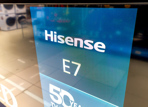 Modern flat-screen Hisense E7 QLED tv for sale in an electronics store