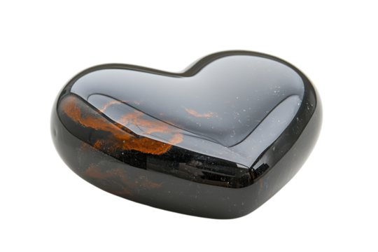 Polished black heart shaped gemstone with warm orange inclusions isolated on black background on transparent background - Powered by Adobe