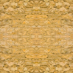 An old yellow wall made of stone and cement. Yellow, stone background. Ancient ruins. Stone texture. Seamless image. Symmetrical.