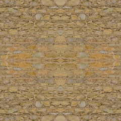 An old yellow wall made of stone and cement. Yellow, stone background. Stone texture. Seamless image. Symmetrical.