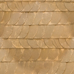 The old yellow tile wall. Yellow stone background. The texture of the tile. Brickwork. Seamless image.