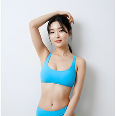 Fototapeta premium Close-Up Portrait of Young Woman in Bright Blue Bikini