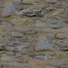 An old, gray wall made of stone and cement. Grey, stone background. Ancient ruins.  Stone texture.