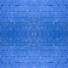 The old blue tile wall. Blue stone background. The texture of the tile. Brickwork. Seamless image. Symmetrical.