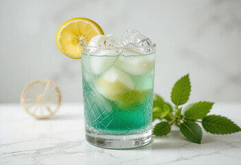 Fototapeta premium A glass of blue liquid with a lemon slice on top